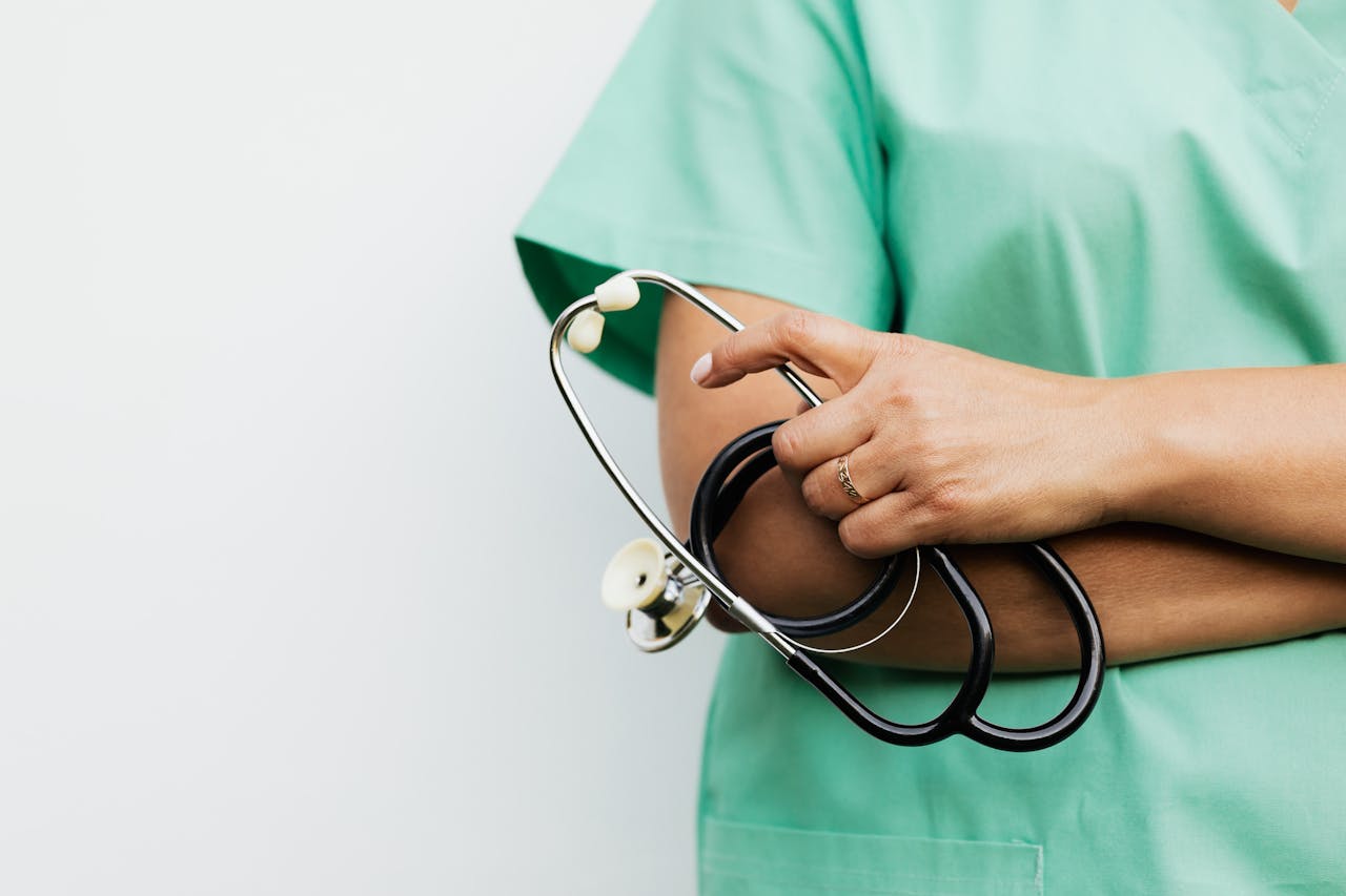 why-choose-us Close-up of a healthcare worker holding a stethoscope, showcasing medical professionalism.